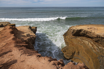 Waves breaking on cliffs, San Diego, California