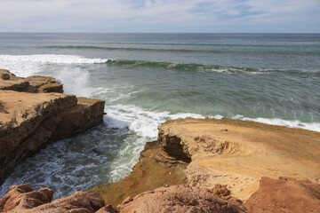 Waves breaking on cliffs, San Diego, California