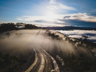 Trans Papua Highway cutting through the mist