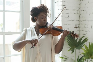 Plus-size African American woman playing violin with deep concentration, embodying musical passion....