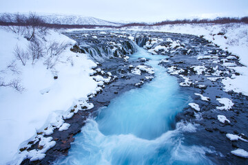 Bruarfoss waterfall in winter, a stand-out and a popular destination among travelers in the Southwest of Iceland. 
