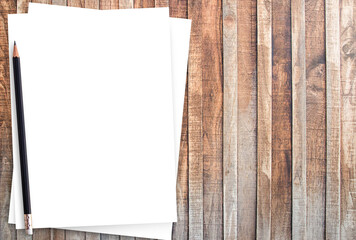 White paper and pencil on old wooden background. - Powered by Adobe