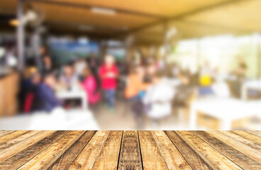 Empty table and blurred store with abstract blurred coffee shop background