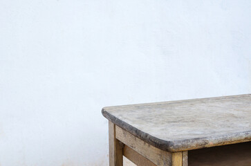 Empty wood table top with blur old concrete background.