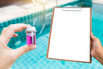 Glass vials and blank report paper on wooden clipboard in girl hand over blurred swimming pool background, outdoor day light, pH test - obrazy, fototapety, plakaty