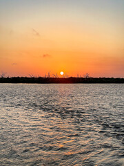 Naklejka premium sunset over water