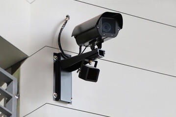 CCTV surveillance camera monitoring surrounding area.
