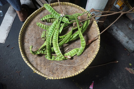 Petai is a tropical fruit on traditional tray from bamboo
