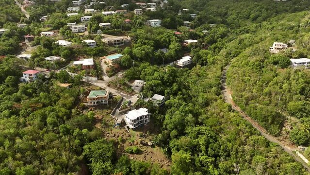 Aerial video of houses in the mountains of St. Thomas, Caribbean