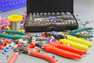 Electrical installation tools for installation of electrical panels. On a metal surface. Close-up.