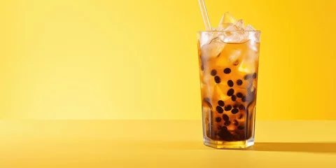 Foto op Plexiglas Cold summer drink made with coffee, milk, ice cubes, and grains on a yellow background. Lots of space available. © Vusal