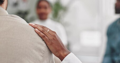 Support, empathy with hand on shoulder in therapy for compassion, sympathy and understanding of mental health. Closeup, people and counseling session with depression, stress and kindness with comfort
