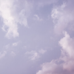 Background of a beautiful pink and pale purple sky with clouds at sunset