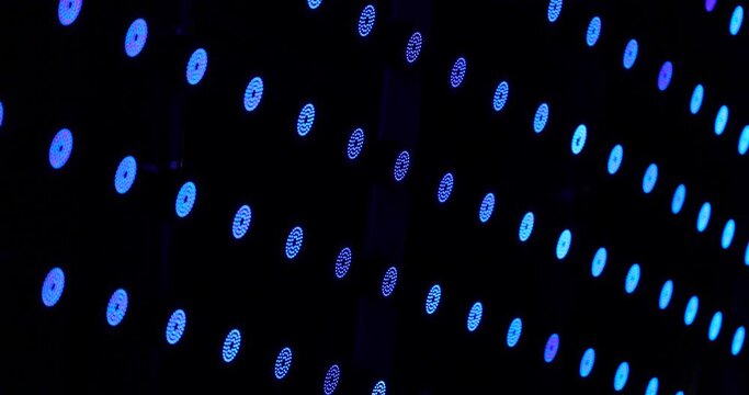 Row Of Small Round Flashing LED Lights On Wall. Tilt Up