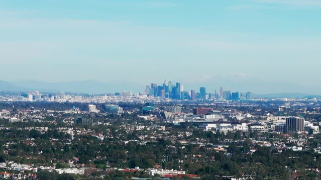 Drone aerial shot of the los angeles skyline in california on sunny day