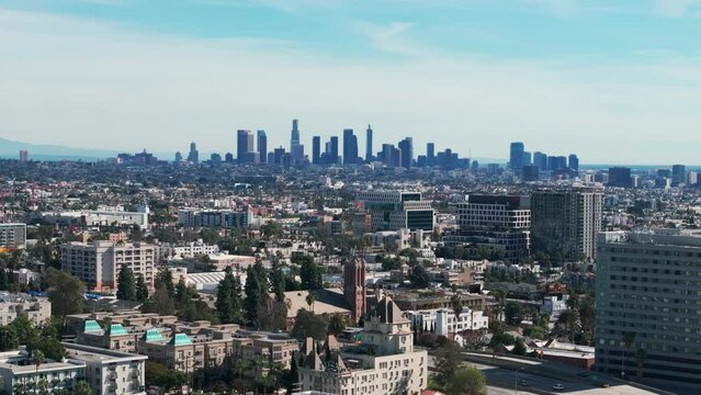 Drone shot flying towards downtown los angeles, California during a sunny day