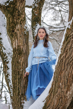 Princess Snow White in the winter forest. Fairy-tale character in bright outfits. A sweet and modern story with emotions.