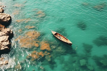 Obraz premium Top view of a boat sailing on the blue sea. Travel, freedom concept