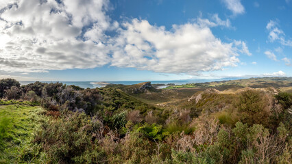 Fototapeta na wymiar Puponga Hilltop Track landscape: Scenic coastal hike offering panoramic views of New Zealand's West Coast, Cape Farewell and Tasman Sea