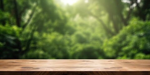 Wooden table top in a green forest or garden, offering a fresh and relaxing concept for product...
