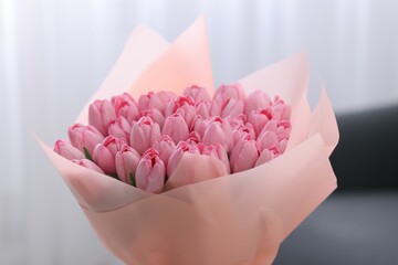 Bouquet of beautiful pink tulips indoors, closeup