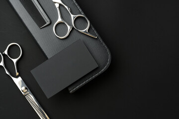 Hairdressing scissors and businesscard mock up on black background