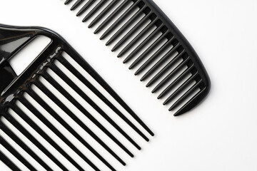 Black plastic hair comb isolated on white background