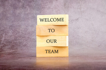 Concept words Welcome to our team on wooden blocks. The concept of a business idea