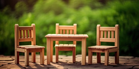 Fototapeta na wymiar Outdoor wooden furniture on a green blurry backdrop.