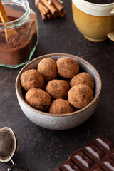 Chocolate truffle candies sprinkled with cocoa. Dessert. Vegetarian food.