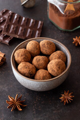 Chocolate truffle candies sprinkled with cocoa. Dessert. Vegetarian food.