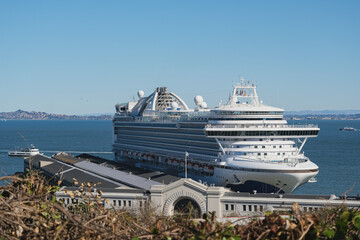 Modern mega cruiseship cruise ship liner Royal or Regal docked at terminal in port San Francisco,...
