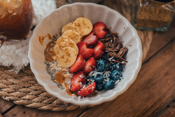 Oatmeal topped with fruit Chocolate and bee pollen