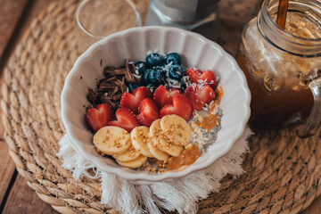 Oatmeal topped with fruit Chocolate and bee pollen