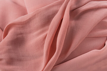 Soft pink fabric shaped as female genital organs, vulva and labia