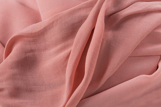 Soft pink fabric shaped as female genital organs, vulva and labia