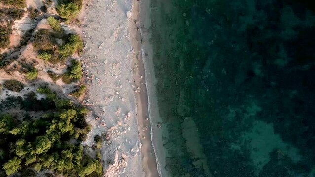 Picturesque Beach With Turquoise Sea Water On Greek Island In Summer. aerial topdown shot