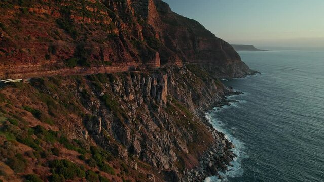 Winding Road Of Chapman's Peak Drive During Sunset In Cape Town, South Africa. Aerial Drone Shot