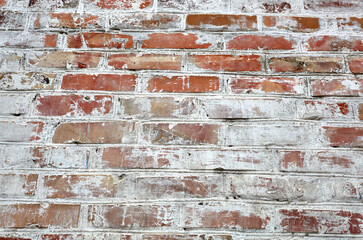 Red white wall background. Old grungy brick wall texture. Vintage wall with obsolete plaster