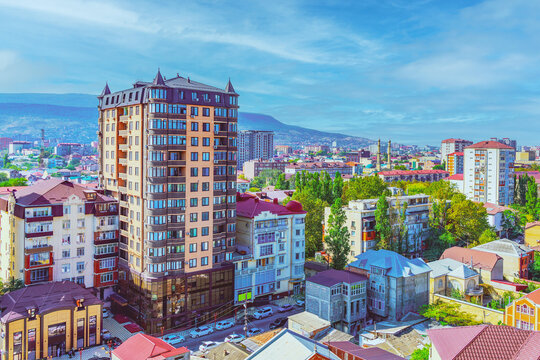 View of the city of Makhachkala in the Republic of Dagestan against a background of blue sky and morning fog. Trip, travel on vacation. Cityscape.