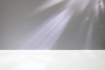 Abstract minimal empty gray, white 3d room background. Modern Studio showcase with copy space. Mock up scene with natural window shadows, crystal caustic light overlay effect. Front view, copy space.
