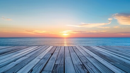 Empty wooden deck with peaceful sunset over natural background, ocean horizon.
