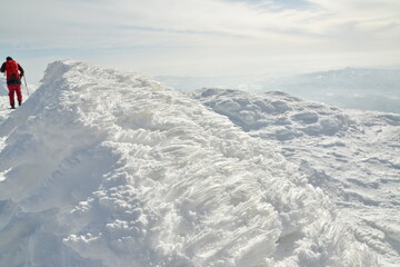 Fototapeta na wymiar Mt Yotei ski touring ascent on sunny winter day Hokkaido Japan
