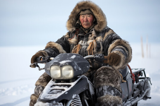 a Chukchi man on a snowmobile in the tundra