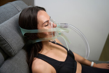 Client lying on couch, recovery and treatment procedure