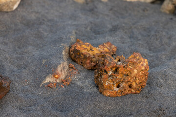 Volcanic rocks thrown from the sea to the shore create a beautiful landscape geological exploratio