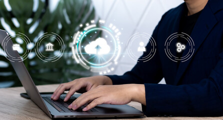 Businessman is using a laptop to access the cloud computing system, cloud computing, big data, business processes, various storage systems, internet of things