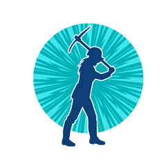 Silhouette of a woman in worker costume carrying pick axe tool in action pose. Silhouette of a female miner in action pose with pick axe tool.