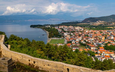 Fototapeta na wymiar Ohrid, North Macedonia - a cityscape view of the city and the lake Ohrid. Famous tourist attraction and travel destination. View of lake from the castle
