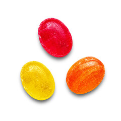 Three colorful hard candies in red, yellow, and orange colors